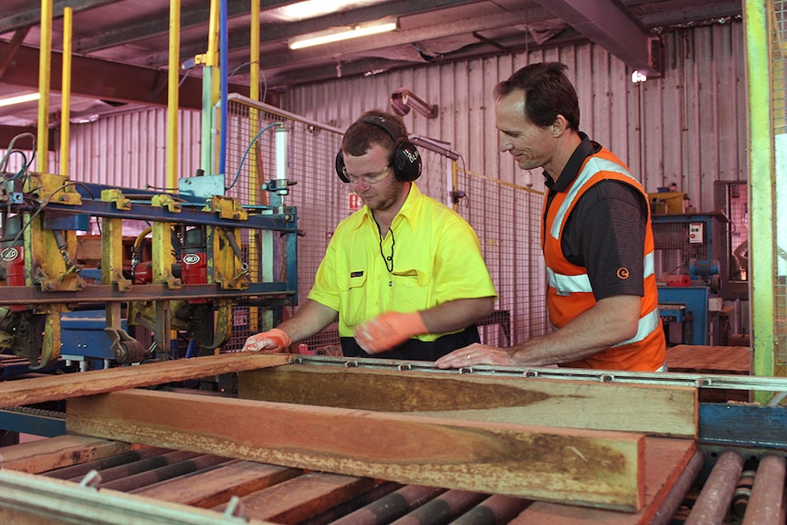 Blake Heinrich receiving some guidance from the Endeavour Foundation's senior industries manager Shaun McAullay.