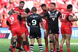 Andrew Fifita and his Tonga teammates celebrate after the final whistle following their win over New Zealand.