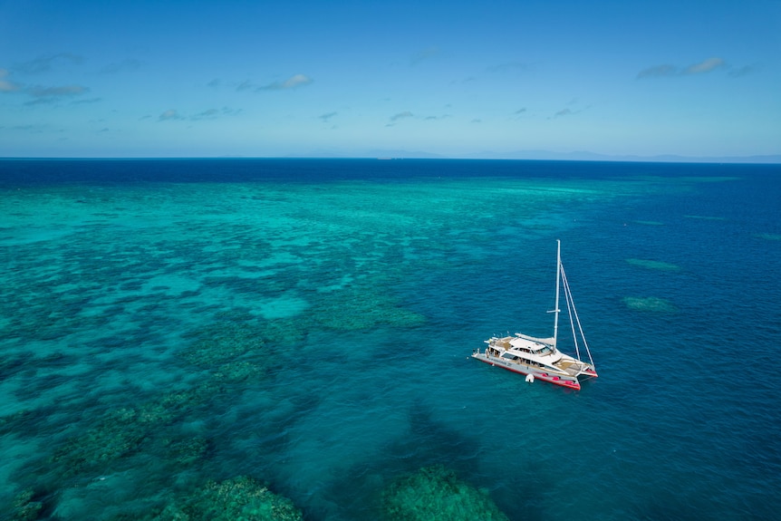 A boat in the middle of the Great Barrier Reef