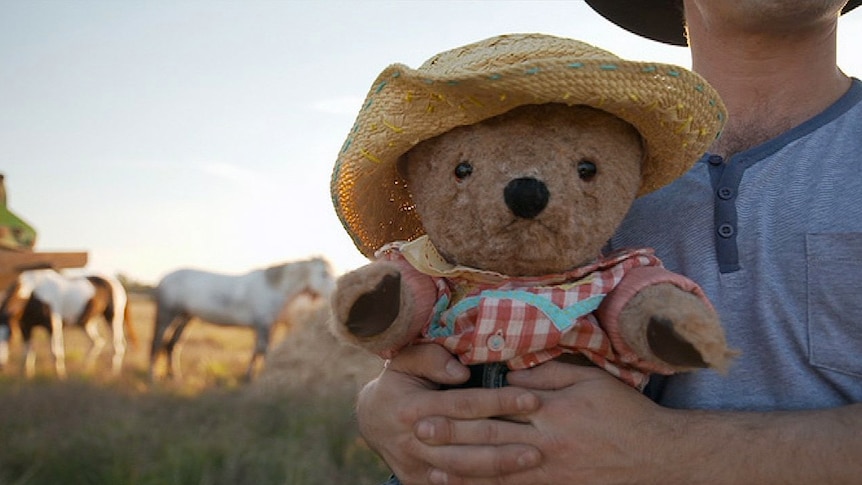 Play School's Little Ted in a hat and shirt for a story about talking about death and grief