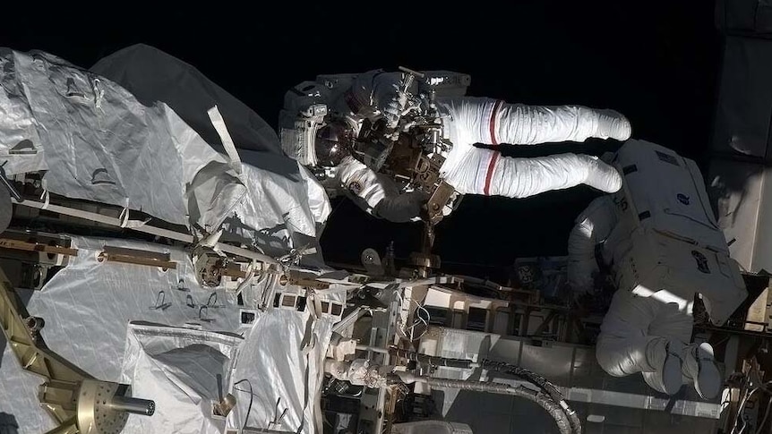 Astronaut goes for a spacewalk outside the International Space Station