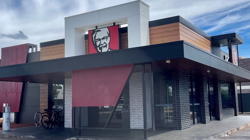 commercial building with red shade cloth 