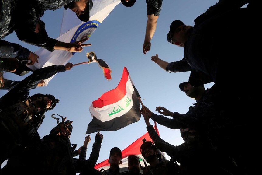 Iraqi Federal police celebrate in West Mosul.