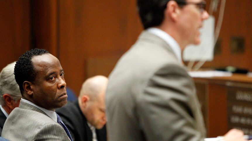 Conrad Murray looks to his defence attorney Edward Chernoff during his involuntary manslaughter trial