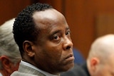 Conrad Murray looks to his defence attorney Edward Chernoff during his involuntary manslaughter trial
