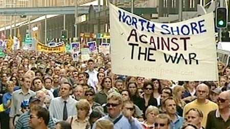John Howard accused protesters against the war in Iraq of giving comfort to Saddam Hussein