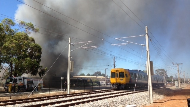 Train in smoke from industrial fire