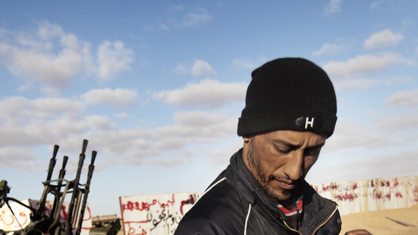 Rebel fighters man their anti-aircraft guns in the oil-rich town of Ras Lanuf