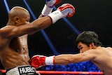 Manny Pacquiao throws a left at Floyd Mayweather during their title bout in Las Vegas in May 2015.