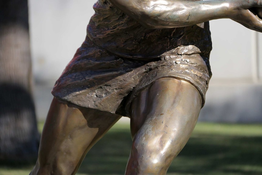 Close up of a statue of Darren Lockyer outside Lang Park.