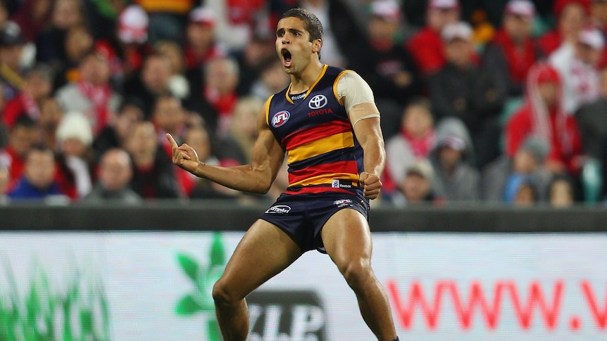 Cop that: Jared Petrenko celebrates one of his three goals in the Crows victory.