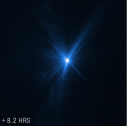 A bright light shows the DART impact glowing 8 hours after impact