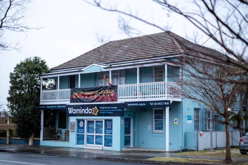 A double story blue building stands on the main street of the small town of Nowra