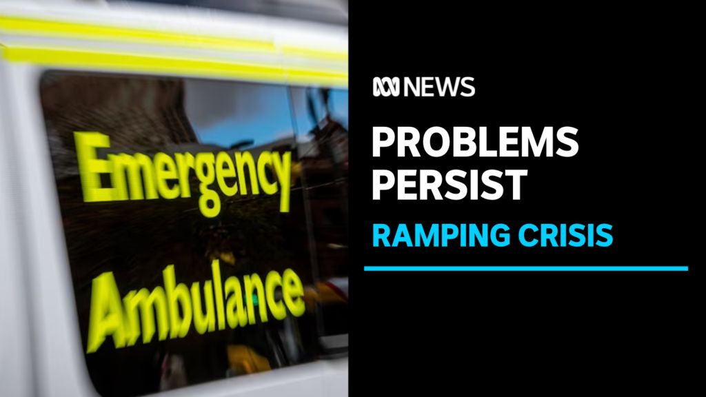 Problems Persist, Ramping Crisis: Close up of the words 'Emergency Ambulance' on a tinted vehicle window.