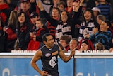 Golden boot ... Eddie Betts celebrates one of his bag of goals against Essendon.