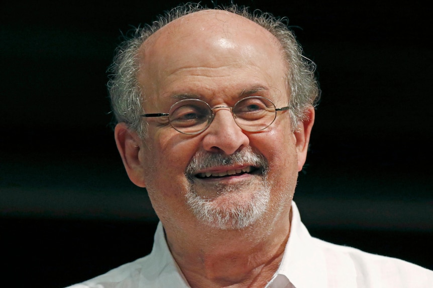 Salman Rushdie smiles