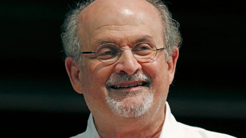 Salman Rushdie smiles