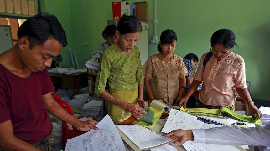 Rakhine state election commission staff count ballot papers