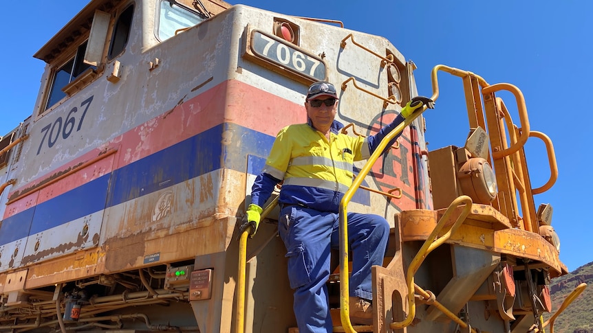 Paul Lenehan from Rio Tinto takes gives up the drivers seat on a Pilbara iron ore train