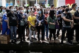 A group of people in Manila in face masks