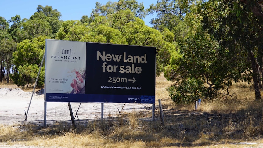 A sign advertising land for sale at Paramount Estate in Baldivis.