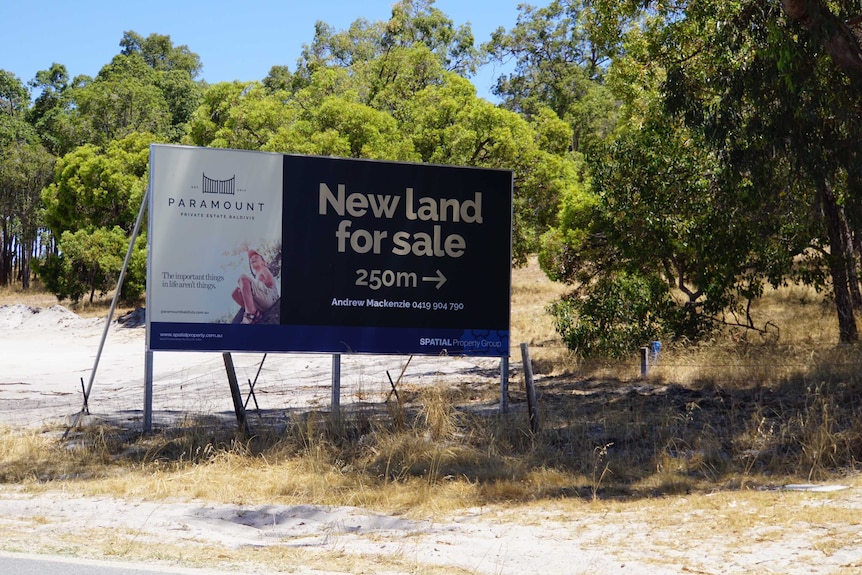 A sign advertising land for sale at Paramount Estate in Baldivis.