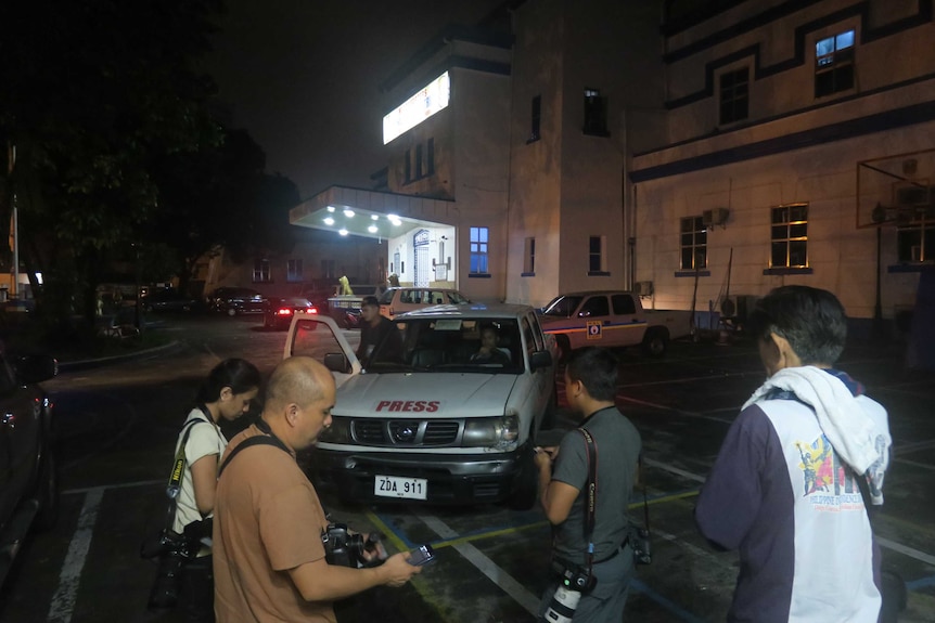 Filipino media at police headquarters in Manila