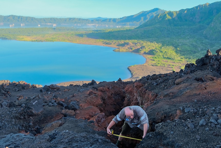 The RVO's Steve Saunders measures a crack near the crater of Tavurvur