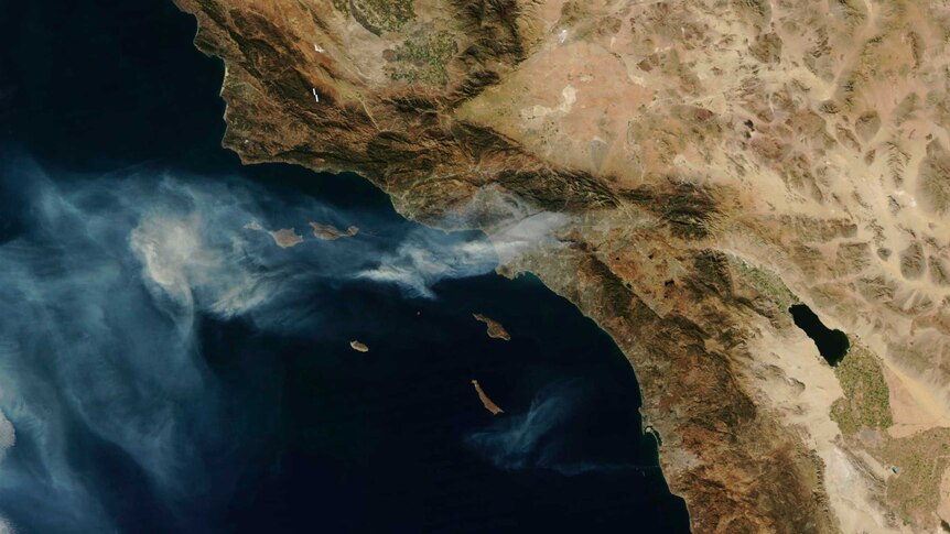 A satellite image of America's west coast blanketed in smoke