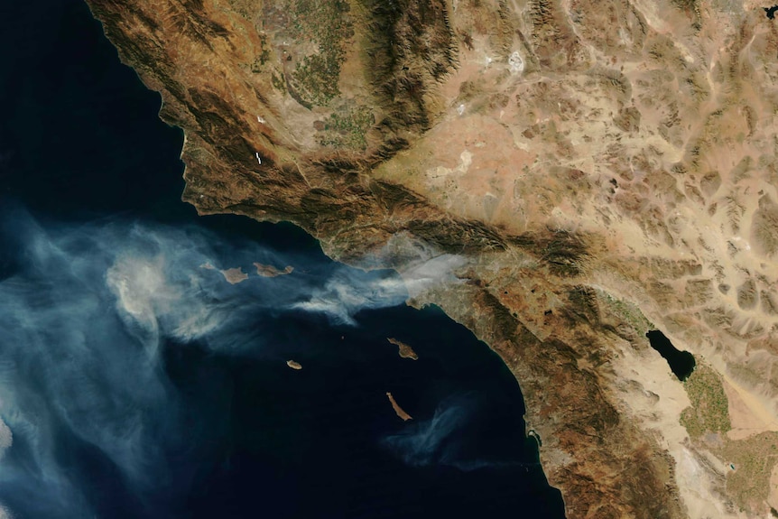 A satellite image of America's west coast blanketed in smoke