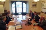 New Tasmanian Liberal Leader Will Hodgman (middle right) holds a meeting with bureaucrats and MPs.