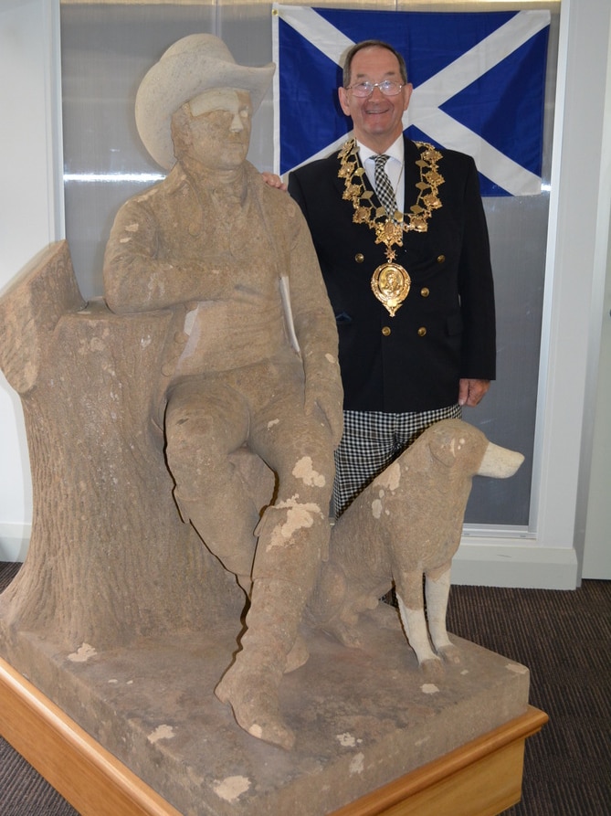 Dr Peter Hughes with the Robert Burns statue in Camperdown