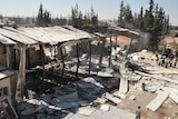 Damage at the site of an attack on the pro-government Al-Ikhbariya satellite television channel's offices outside Damascus.