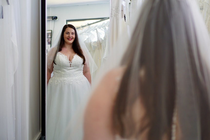 Hayley Harris is an ADHD bride trying on a wedding dress at the bridal shop English Rose Bridal in Perth