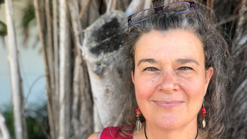 NT author Karen Manton in front of a banyan tree in downtown Darwin.