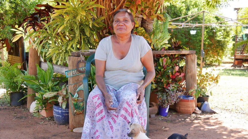 Jody Wiggan sits in front of her garden in Djarrinjin.