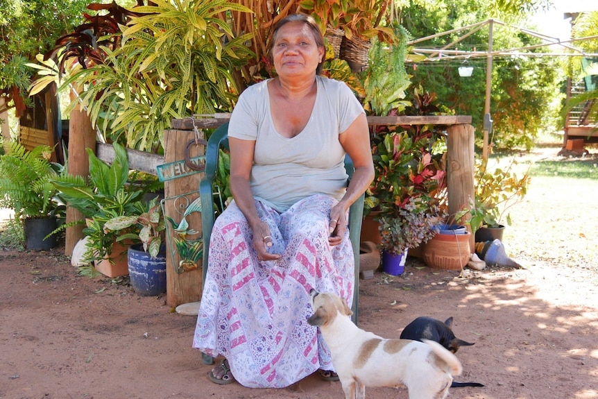 Jody Wiggan sits in front of her garden in Djarrinjin.