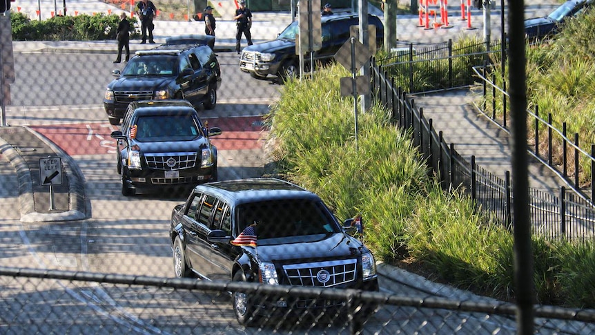 The presidential motorcade leaving Marine One's landing site in Herston.