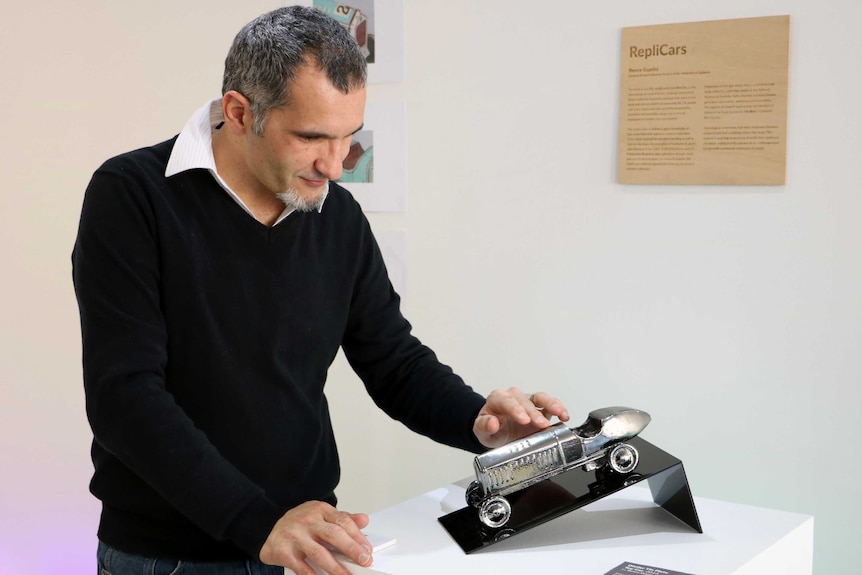 University of Canberra PhD student Beaux Guarini with printed item