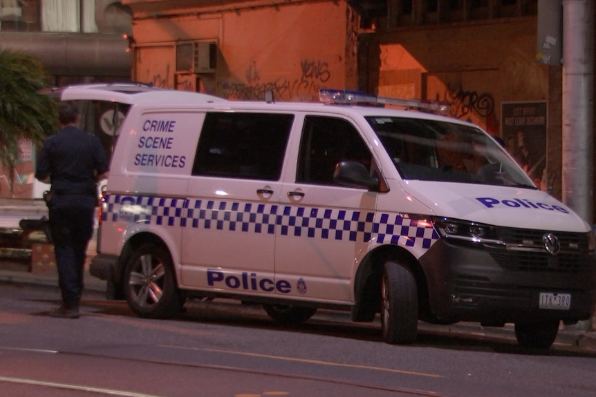 A Crime Scene Services van on a road in the early hours of the morning.