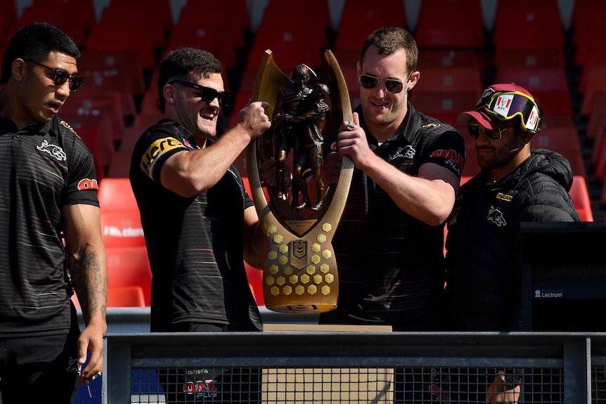 Panthers players with the NRL trophy