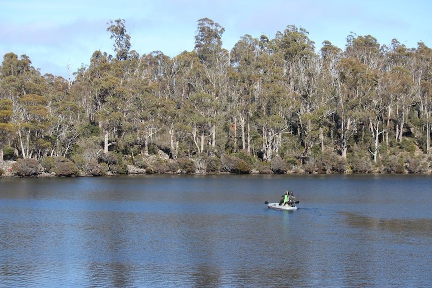 Greg French and a friend in a boat on Lake Malbena, from a distance