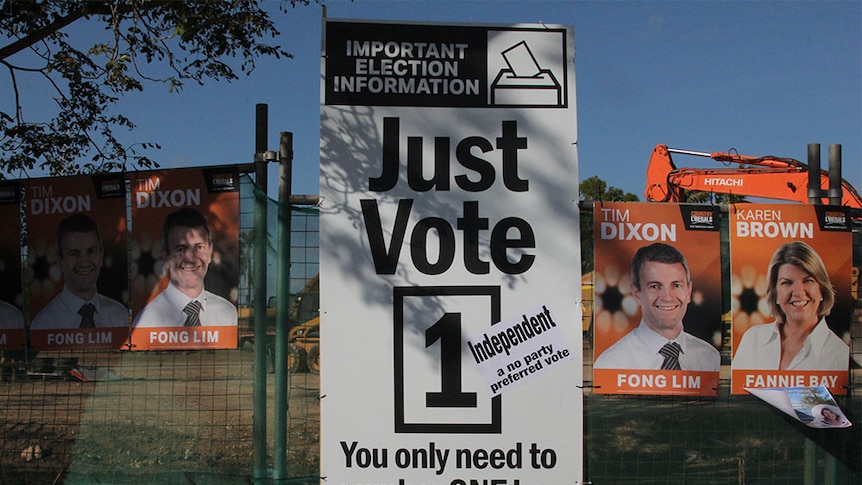 a sign saying just vote one in election font