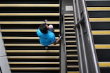 A man climbing stairs seen from above