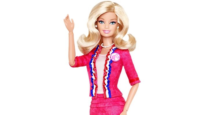 Barbie wearing a pink blazer with red, white and blue trim.