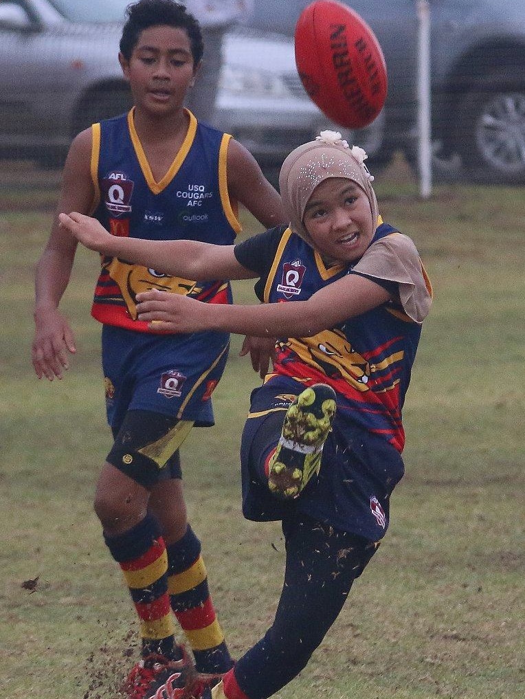 Under 12 AFL players in action