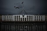 A photo of Parliament House in Canberra on a gloomy day.