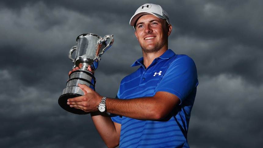 American golfer Jordan Spieth poses with the Stonehaven trophy after winning the Australian Open.