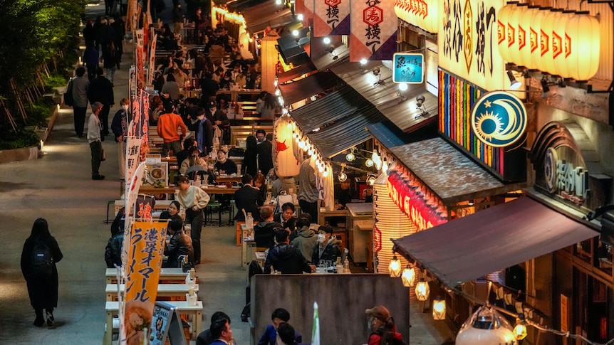 People gather at bars and restaurants later in the evening