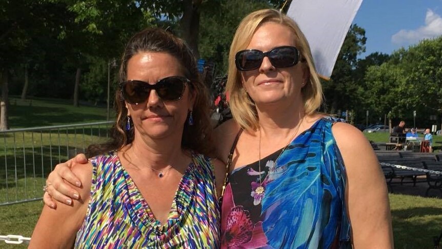 Rosie McGowan and Lindsay Ainger stand together in a park.